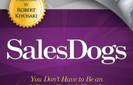 Reading in a book : SalesDogs: Unleashing Your Income Potential through Effective Sales Techniques